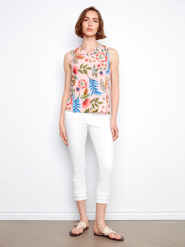 A charming floral print enhances the playful look of this casual V-neck top by Charlie B.