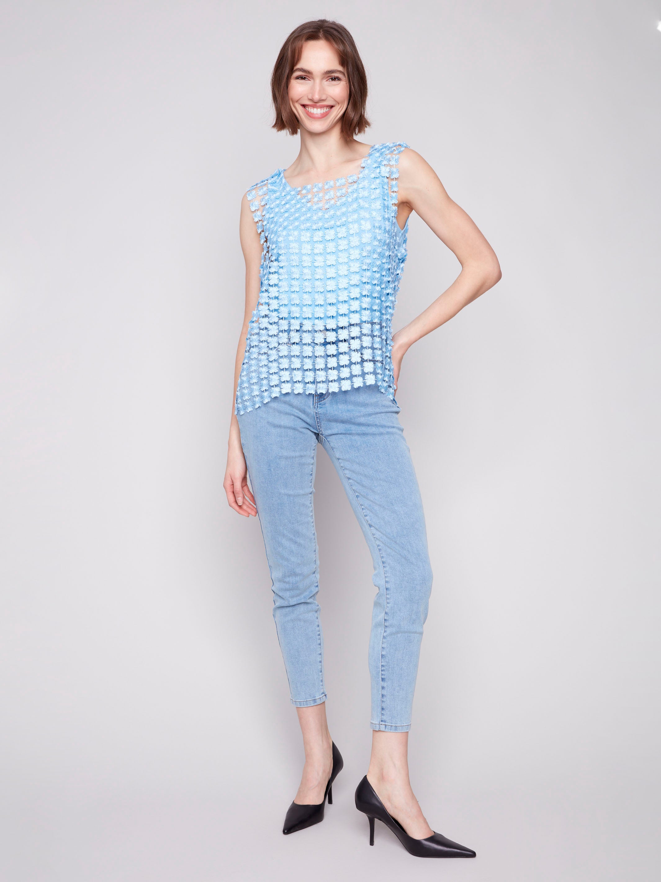 Crochet flower pattern adds a touch of elegance to this stylish top by Charlie B.