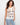 The top features a classic crew neckline, adding elegance to any outfit. Designed by Charlie B.