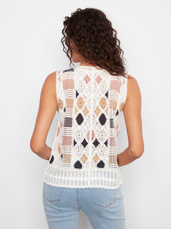 Elevate your fashion game with the artistic geometric patterns of this sleeveless masterpiece. By Charlie B.
