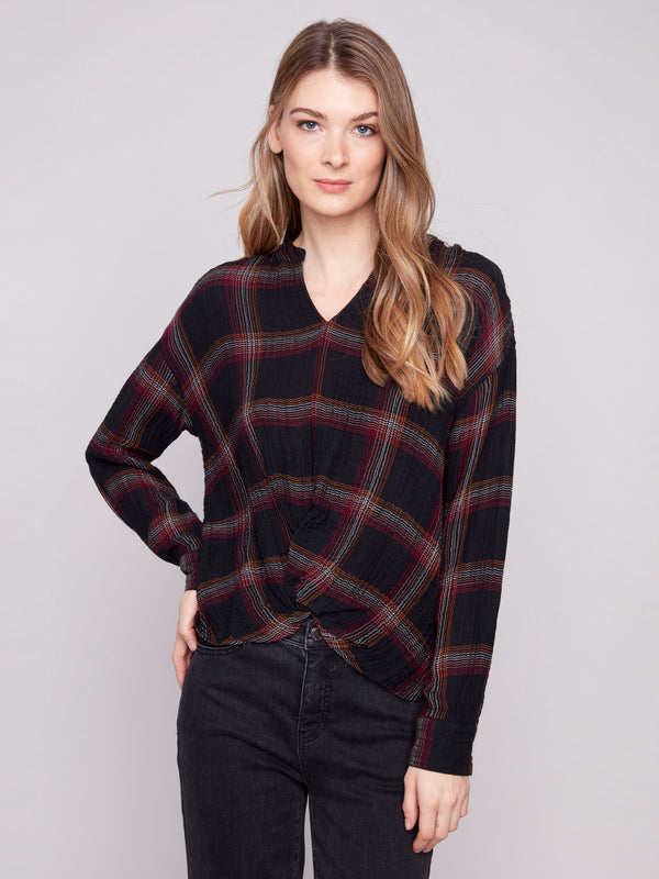 Plaid blouse featuring a V-neck with Mao collar, adding elegance to the design by Charlie B.