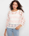 Crochet sweater featuring a boat neckline and intricate floral patterns, offering a chic style in a cotton blend by Charlie B.