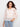Crochet sweater featuring a boat neckline and intricate floral patterns, offering a chic style in a cotton blend by Charlie B.
