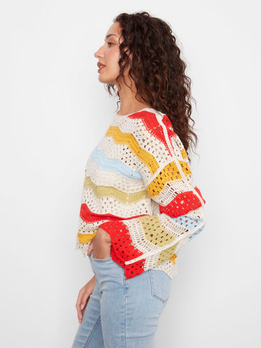 Crochet top with colorful pattern and 3/4 bell sleeves, offering a unique flair to your ensemble by Charlie B.