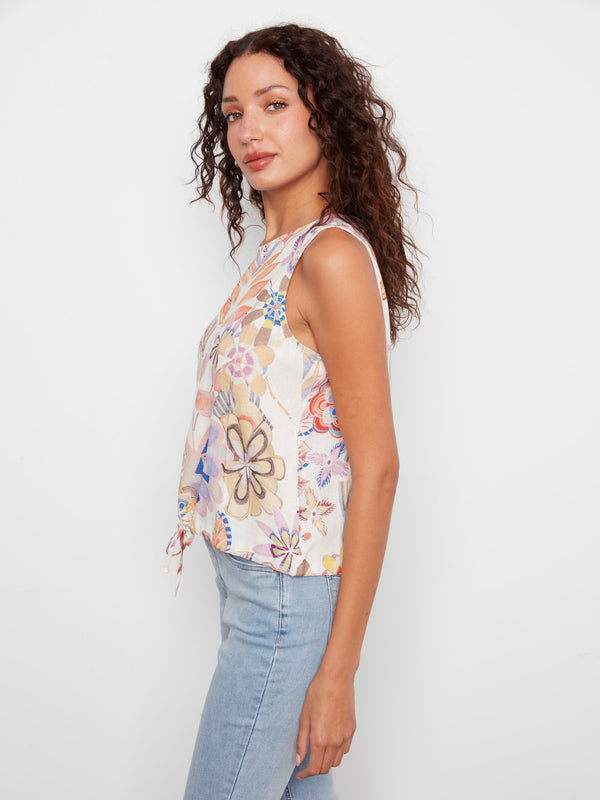 The sleeveless design of this vibrant Maui print top offers comfort and style for warm weather days. By Charlie B.