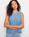 Blue sleeveless top featuring a loose fit and scalloped hem, perfect for casual wear by Charlie B.