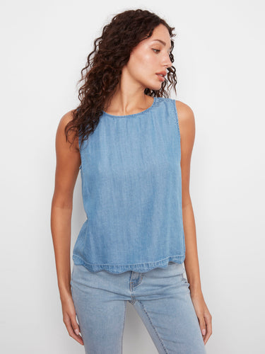 Casual light blue sleeveless top showcasing a loose fit and delicate scallop hem detail by Charlie B.