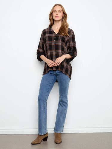 This plaid shirt includes a convenient chest pocket, adding functionality to its fashionable design by Charlie B.