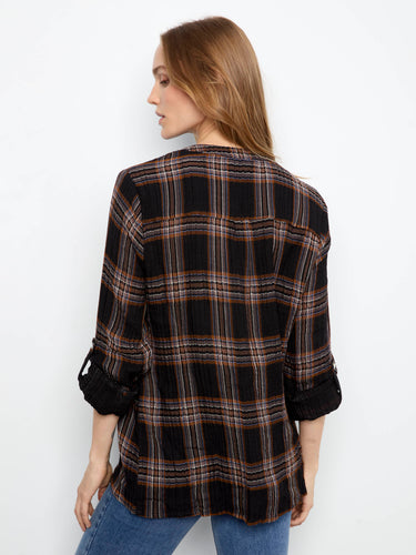 The half-button placket on this plaid shirt adds a touch of elegance to its casual appeal by Charlie B.