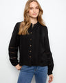 Elegant black blouse with textured crepe fabric and button-front closure, perfect for a chic look by Charlie B.