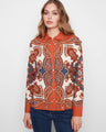 Paisley patterned shirt with a classic neckline, featuring intricate designs in warm tones. Perfect for any occasion by Charlie B.