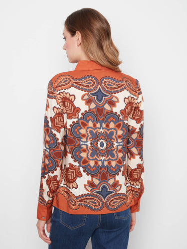 This exquisite long-sleeved shirt showcases vibrant paisley motifs that bring flair to any outfit by Charlie B.