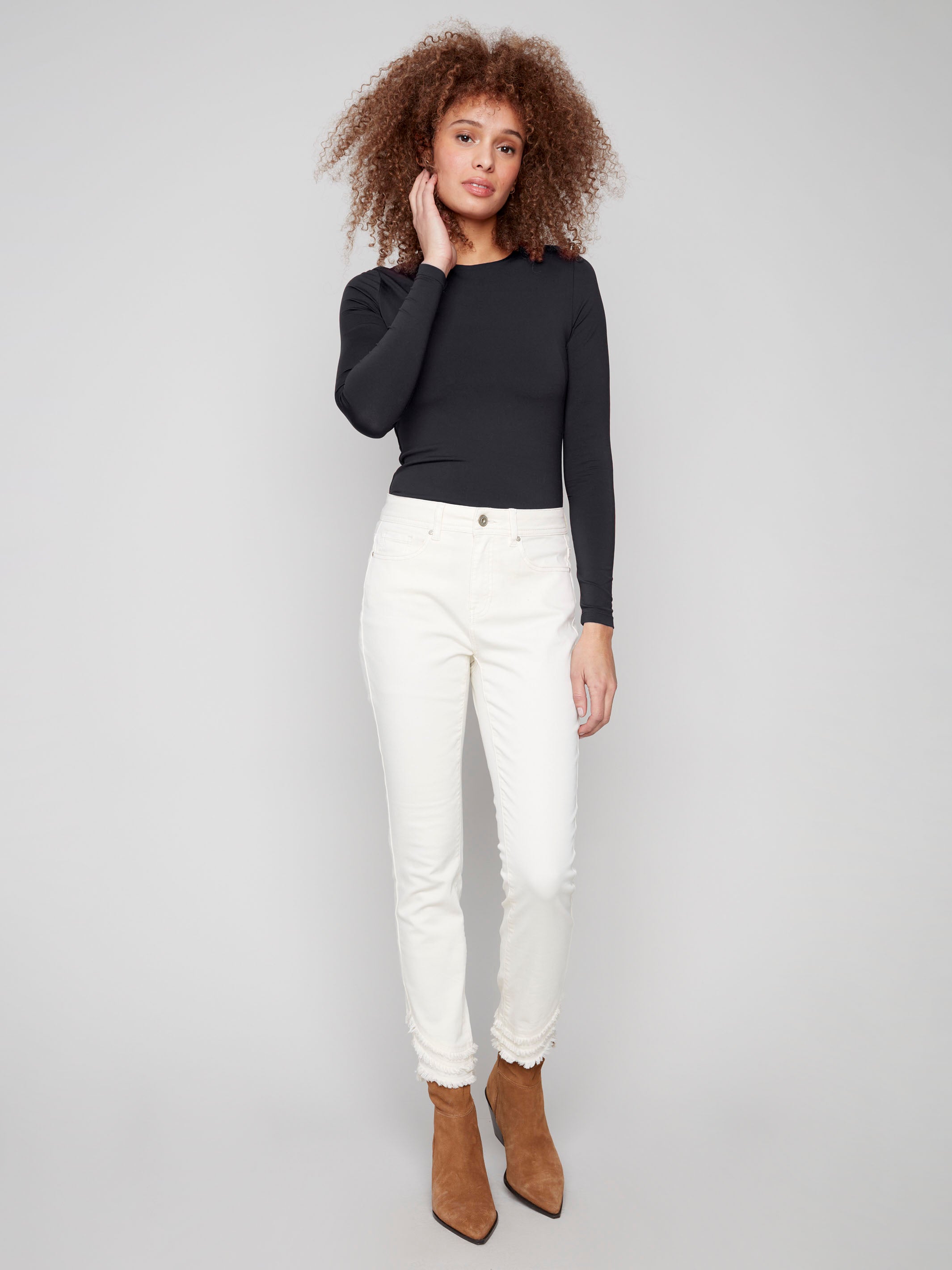 Natural-colored pants in a slim fit, featuring stretch denim fabric and stylish frayed hem by Charlie B.