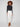Stretch denim skinny pants with a regular rise waist and chic frayed hem detail by Charlie B.