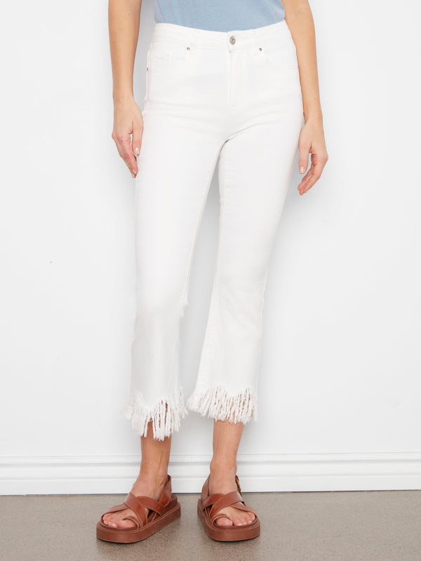 Stylish white cropped jeans featuring stretch denim material and a fringed hem for added flair by Charlie B.