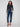 Dark blue slim leg jeans with a cuffed hem, featuring a classic five-pocket design and button closure by Charlie B.