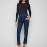 Dark blue slim leg jeans with a cuffed hem, featuring a classic five-pocket design and button closure by Charlie B.