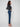 Dark blue slim leg jeans with a cuffed hem, featuring a classic five-pocket design and button closure by Charlie B.
