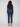 Dark blue slim leg jeans with a cuffed hem, featuring a classic five-pocket design and button closure by Charlie B.