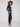 Navy slim-leg techno pants with side zip pockets, offering practical storage and stylish design by Charlie B.