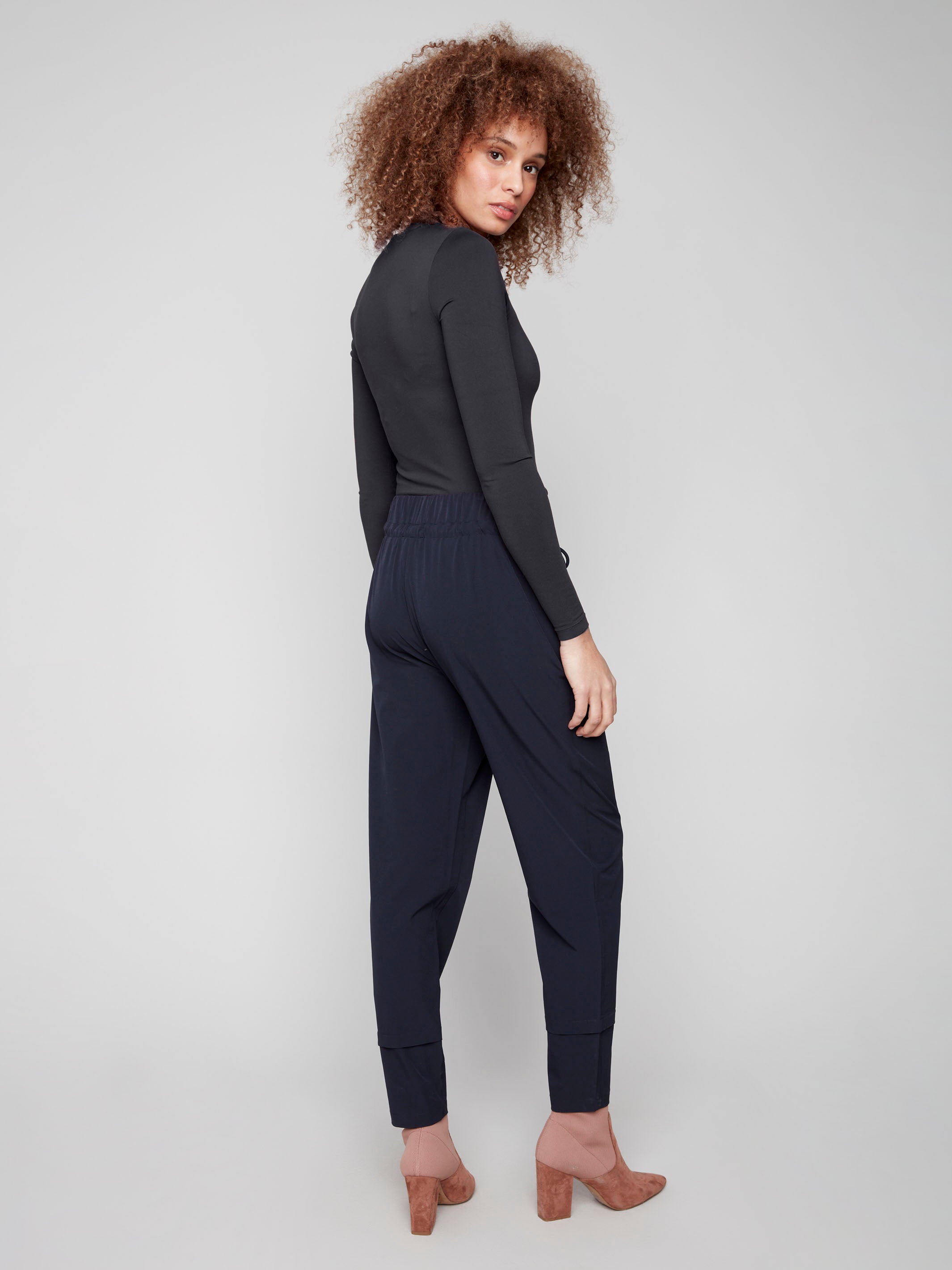 Navy slim-leg techno pants designed with an elastic waistband and drawstring for a perfect fit by Charlie B.