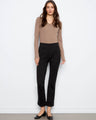 Ankle-length black ponte pants with a regular rise and rolled cuffs, offering a sleek straight leg design by Charlie B.