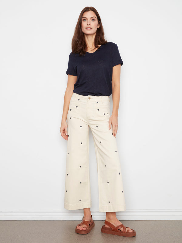 These pants feature a flare fit, perfect for adding a stylish touch to your outfit. Designed by Charlie B.