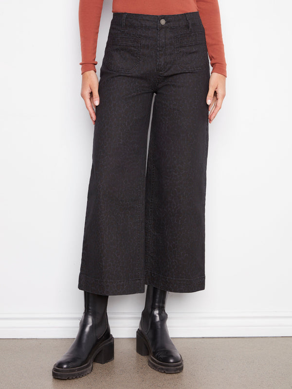 Cropped leopard print pants with convenient front patch pockets for added style and utility by Charlie B.