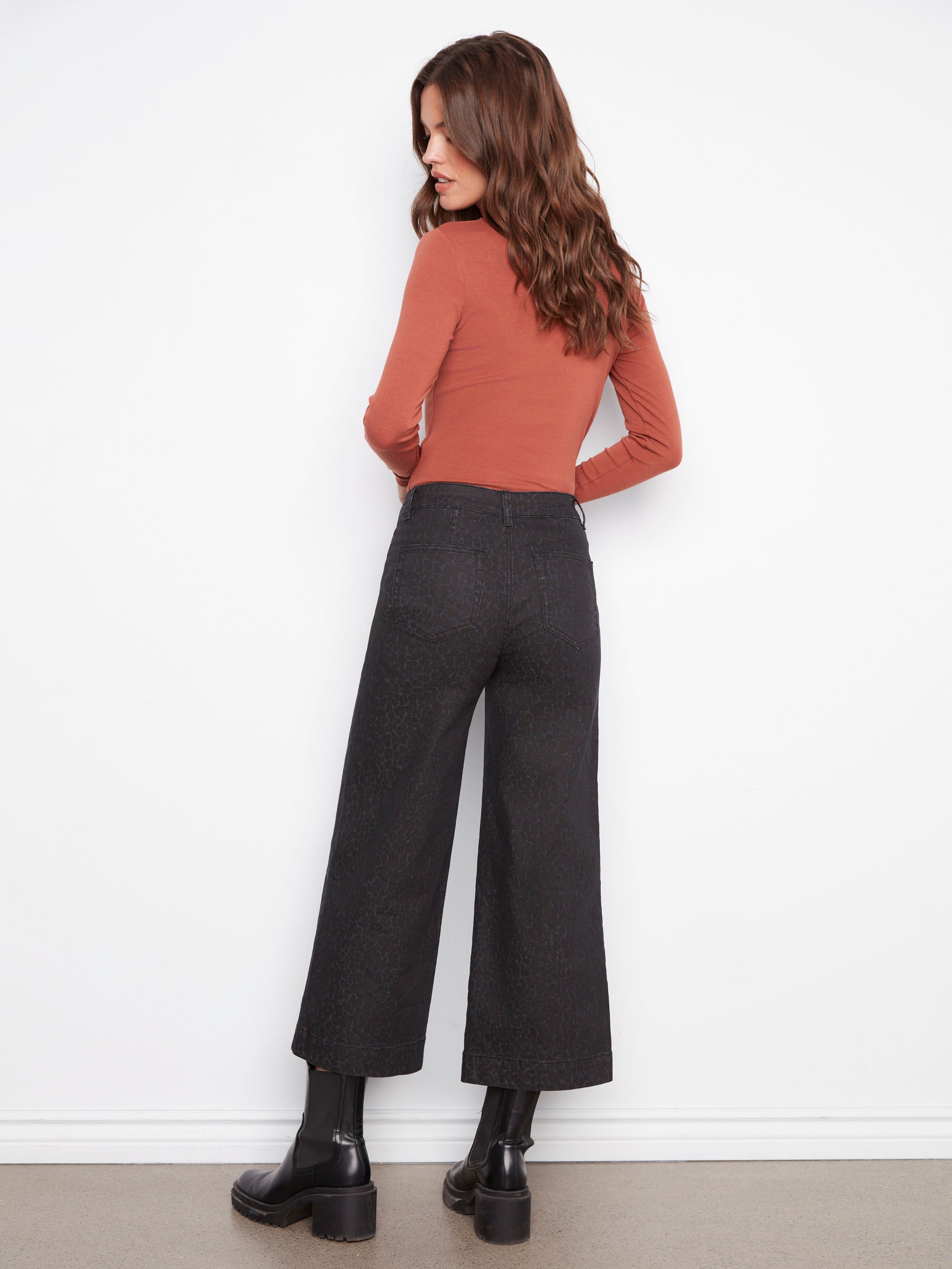 Designed with a regular rise, these leopard print pants offer a flattering fit for any casual ensemble by Charlie B.