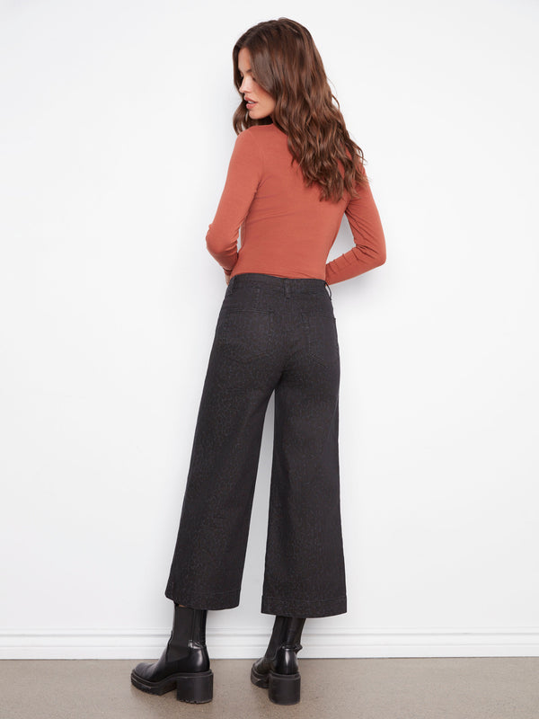 Designed with a regular rise, these leopard print pants offer a flattering fit for any casual ensemble by Charlie B.