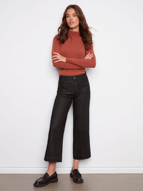 Black cropped flare jeans with a regular rise, featuring stylish back pockets by Charlie B.