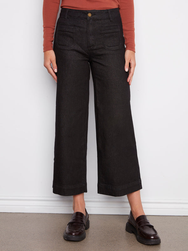 Cropped length black jeans in stretch denim with a chic button front closure by Charlie B.