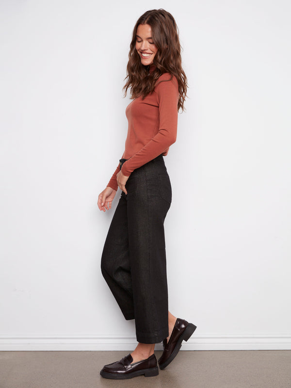 Stylish flare fit black jeans with subtle metallic finish and patch pockets by Charlie B.