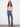 Medium blue jeans with floral embroidery, showcasing a bootcut fit and stretch denim for comfort by Charlie B.