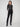 Black slim-fit dress pants with a comfortable elastic waistband and two back welt pockets, ideal for any occasion by Charlie B.