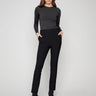 Black slim-fit dress pants with a comfortable elastic waistband and two back welt pockets, ideal for any occasion by Charlie B.