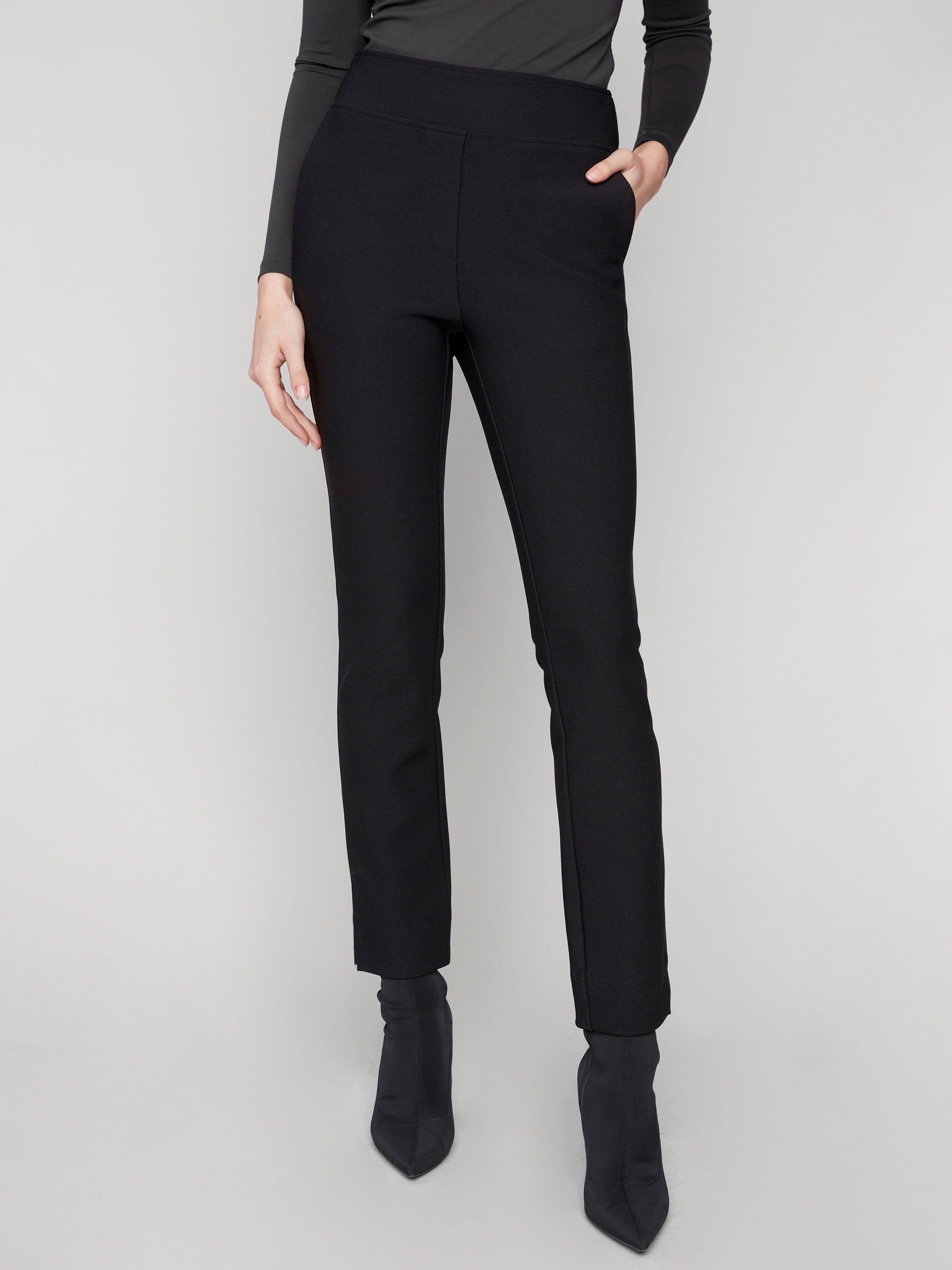 These black dress pants feature a sleek design with stretch fabric and two side pockets, offering both style and utility by Charlie B.