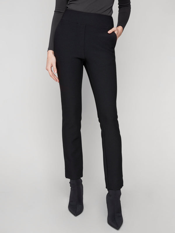 These black dress pants feature a sleek design with stretch fabric and two side pockets, offering both style and utility by Charlie B.