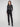 Dress pants in black with a flattering slim fit and practical side pockets, crafted from stretch fabric for ease of movement by Charlie B.