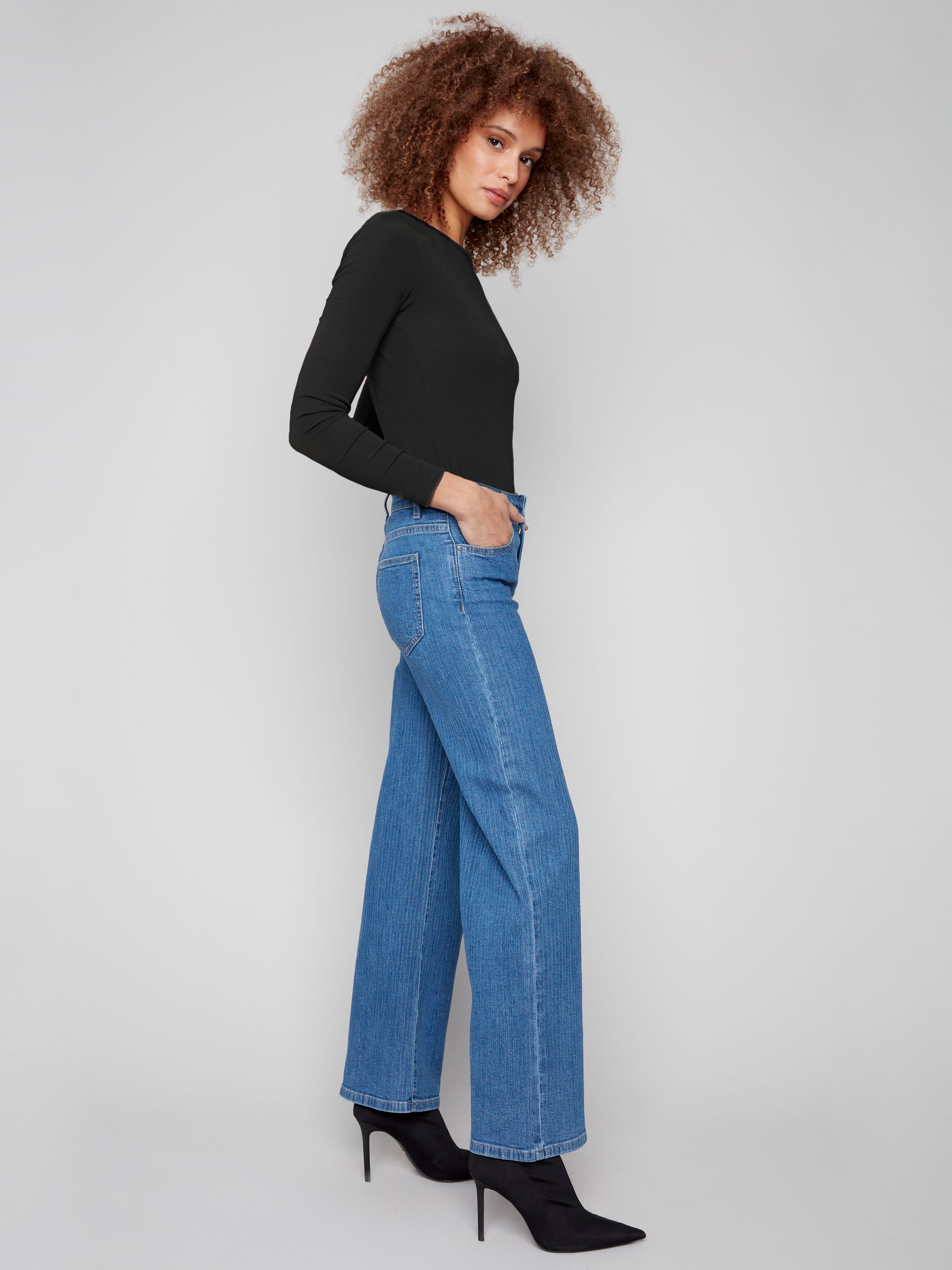 Long length blue jeans featuring a classic five-pocket design and striped pattern by Charlie B.