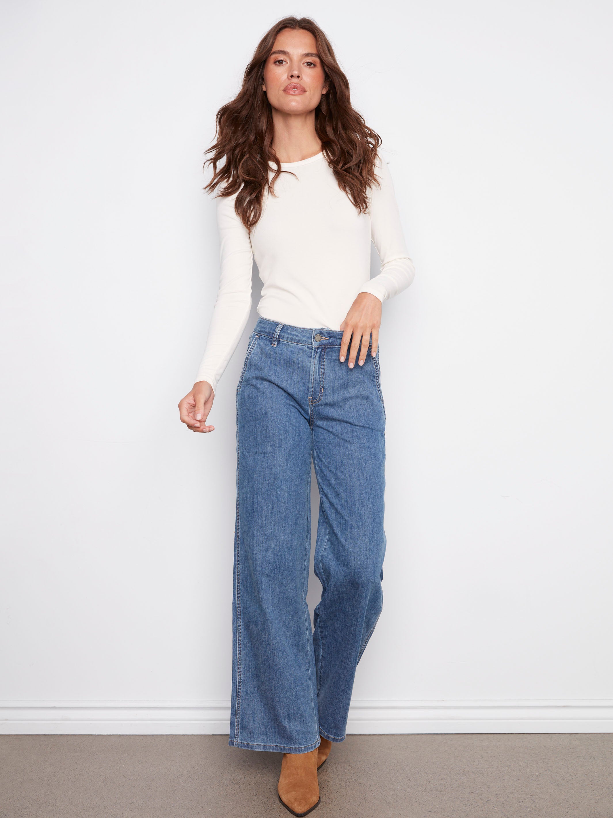 Blue jeans featuring a wide leg design with long length, crafted in comfortable stretch denim fabric by Charlie B.