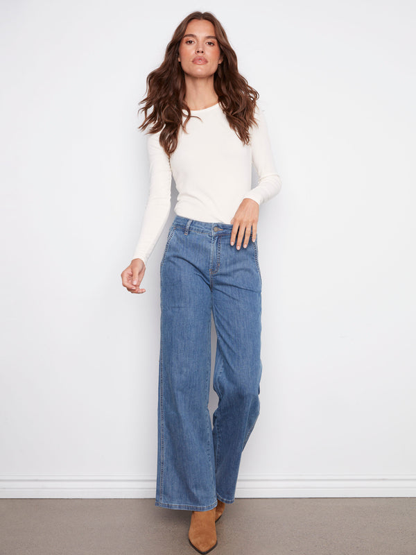 Blue jeans featuring a wide leg design with long length, crafted in comfortable stretch denim fabric by Charlie B.