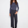 Deep blue jeans with a flattering cropped length, designed for modern style and comfort by Charlie B.