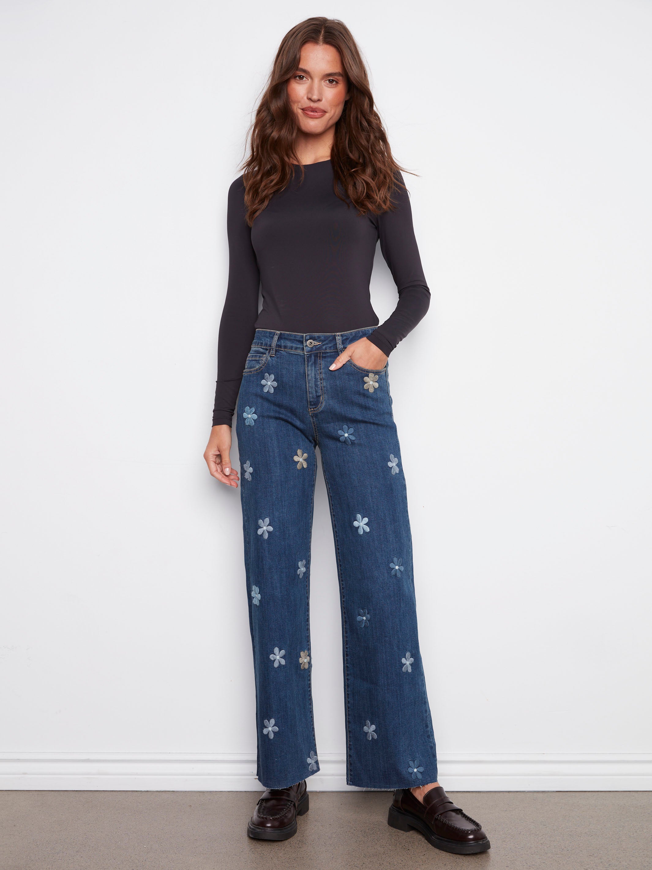 Indigo jeans featuring a regular rise and charming flower patches, offering a stylish look by Charlie B.