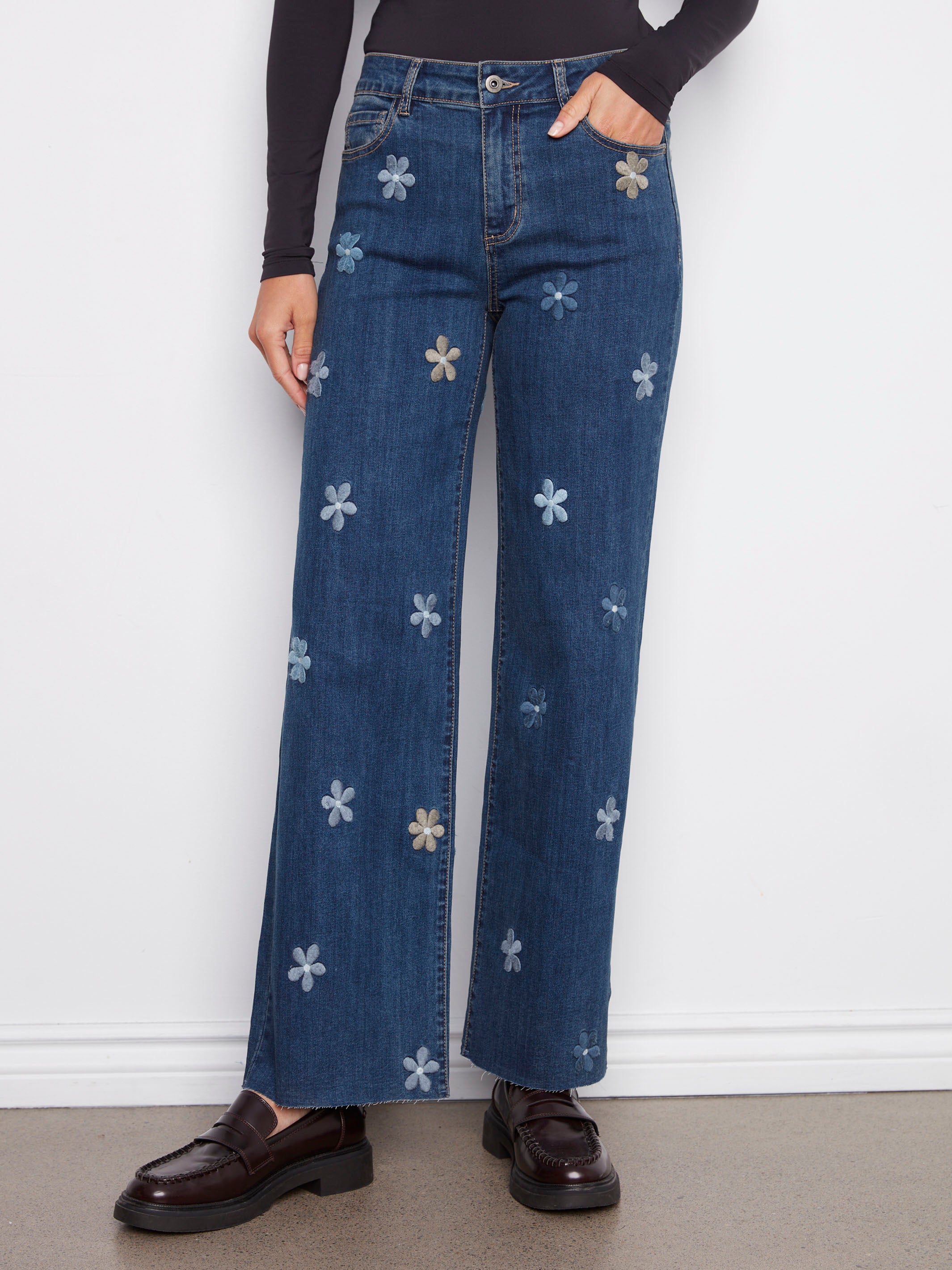 Stylish indigo jeans with stretch denim and playful flower patches for a modern twist by Charlie B.