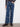 Stylish indigo jeans with stretch denim and playful flower patches for a modern twist by Charlie B.
