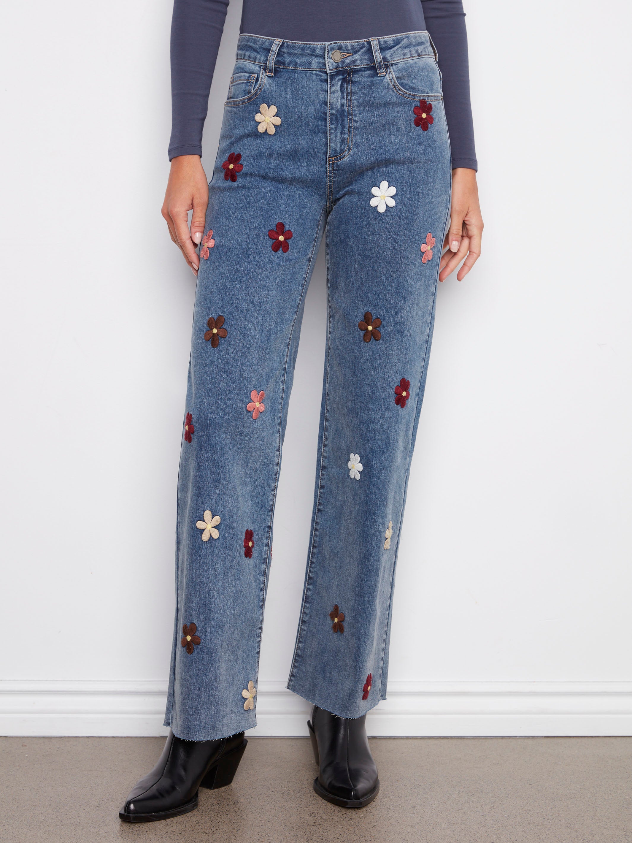 Stretch denim wide leg jeans adorned with colorful flower patches for a playful vibe by Charlie B.