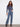 Stylish raw hem and stretch denim create an effortlessly chic look with these floral patch jeans by Charlie B.