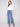 Blue jeans featuring a long length with intricate floral embroidery and sequins by Charlie B.
