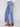 Denim pants with a five-pocket design, showcasing floral embroidery details by Charlie B.